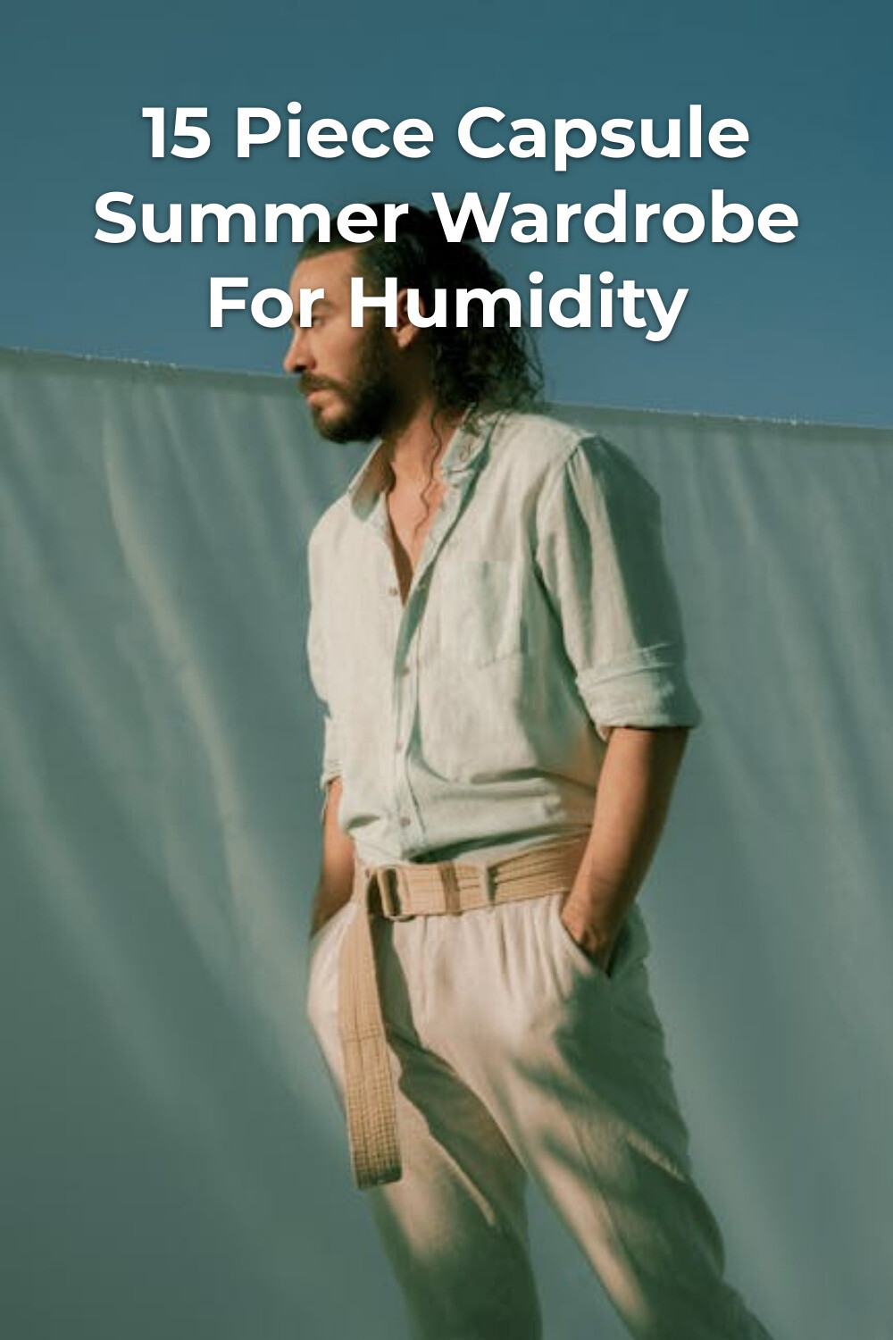 Bearded man in light shirt and pants with wide belt, capsule summer wardrobe minimalist fashion look outdoors