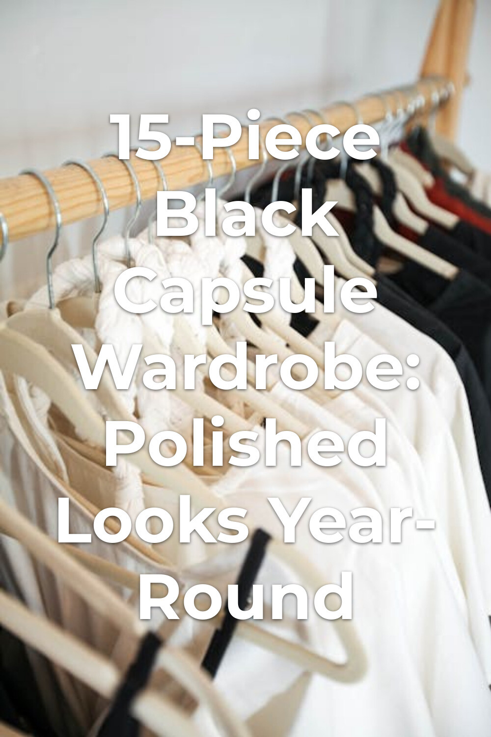 Black Capsule Wardrobe Clothing Rack black capsule wardrobe on wooden clothing rack with light and dark minimalist pieces on hangers