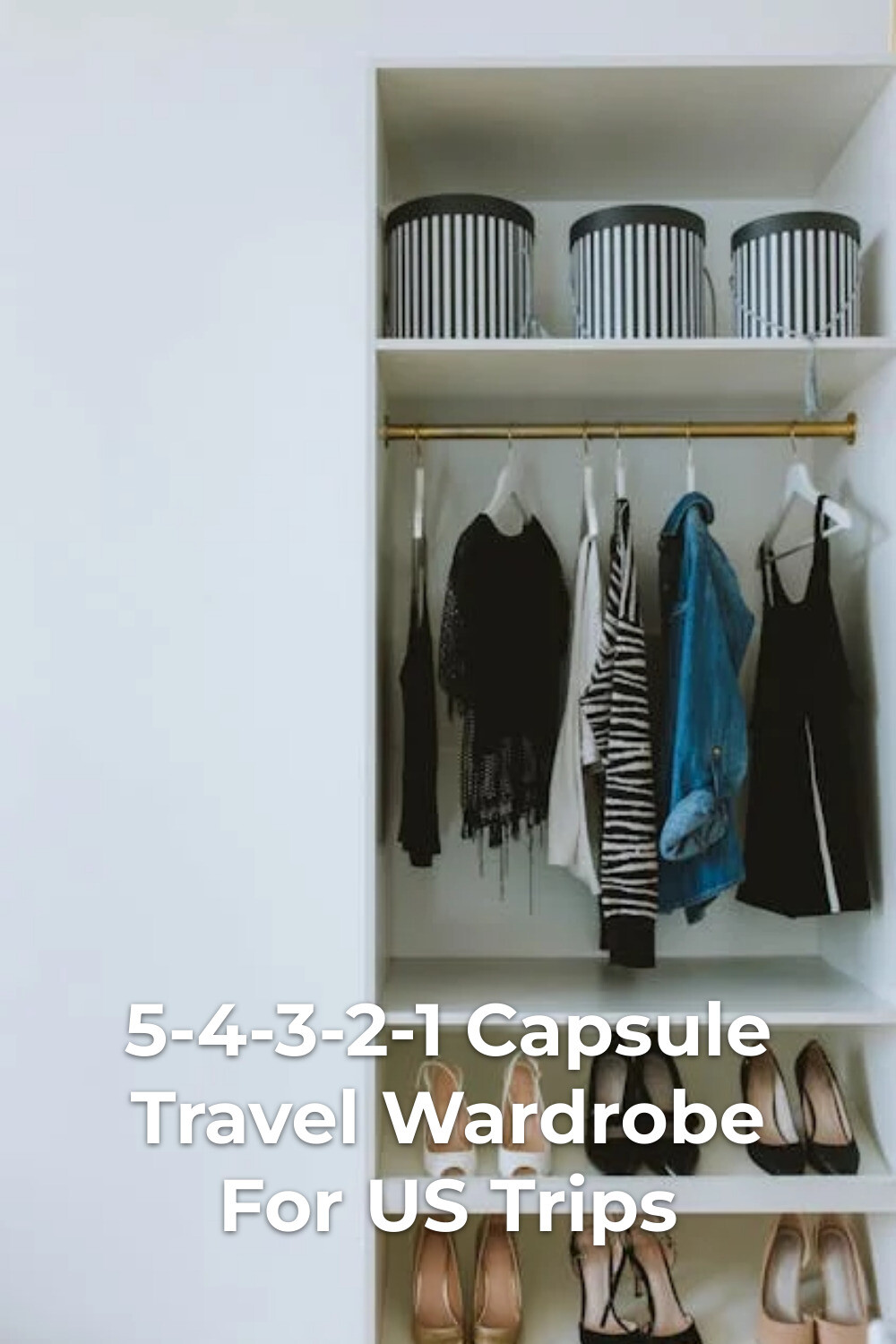 Capsule travel wardrobe in an open closet with striped storage boxes, hanging clothes, and neatly arranged shoes