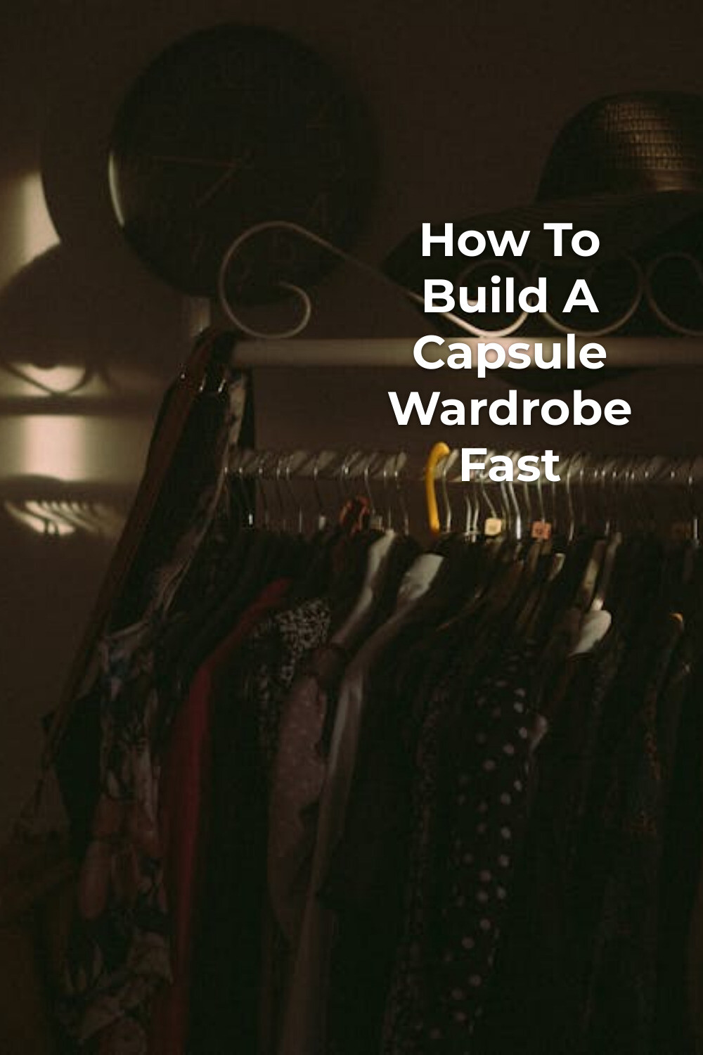 Capsule wardrobe open closet with hats Open closet with capsule wardrobe clothes on hangers and two hats, minimalist style