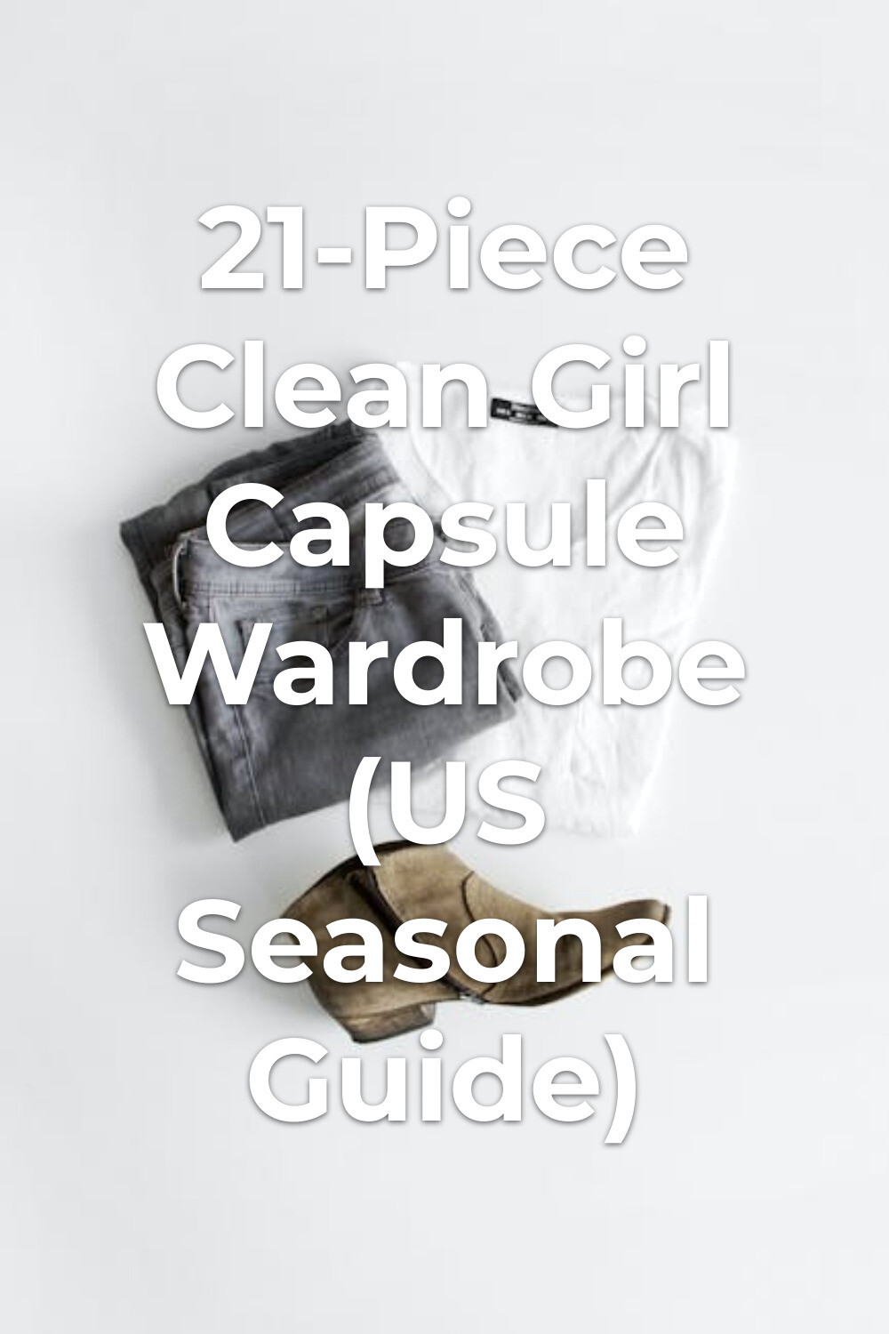 Clean girl capsule wardrobe essentials: folded gray jeans, white shirt and brown ankle boot on white surface