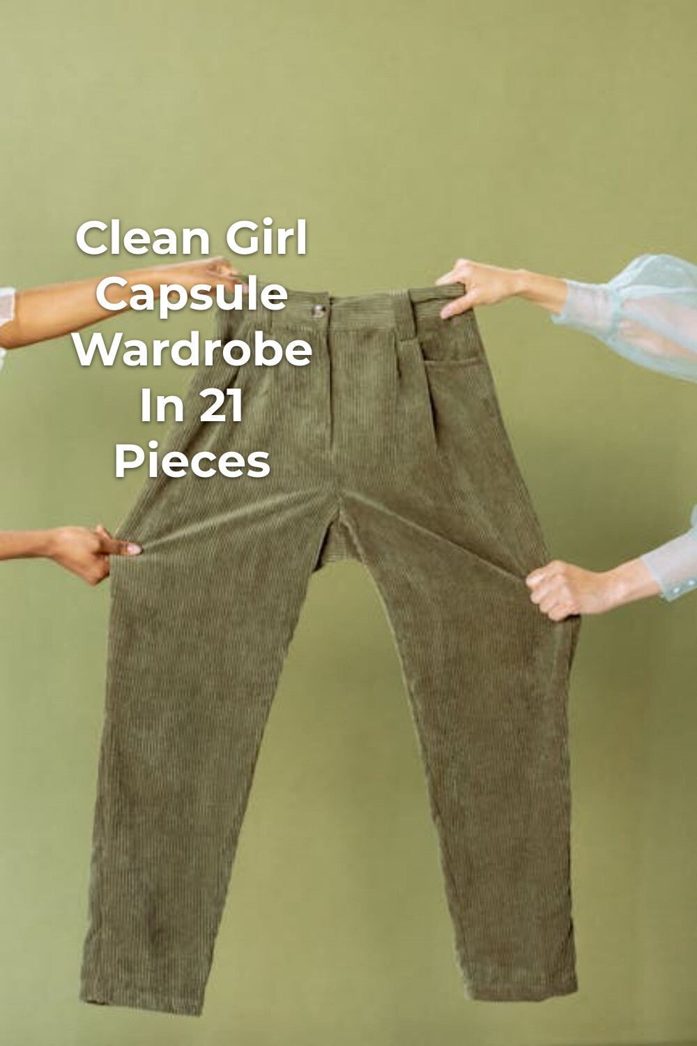 Two people holding up green pants for a clean girl capsule wardrobe against a plain background
