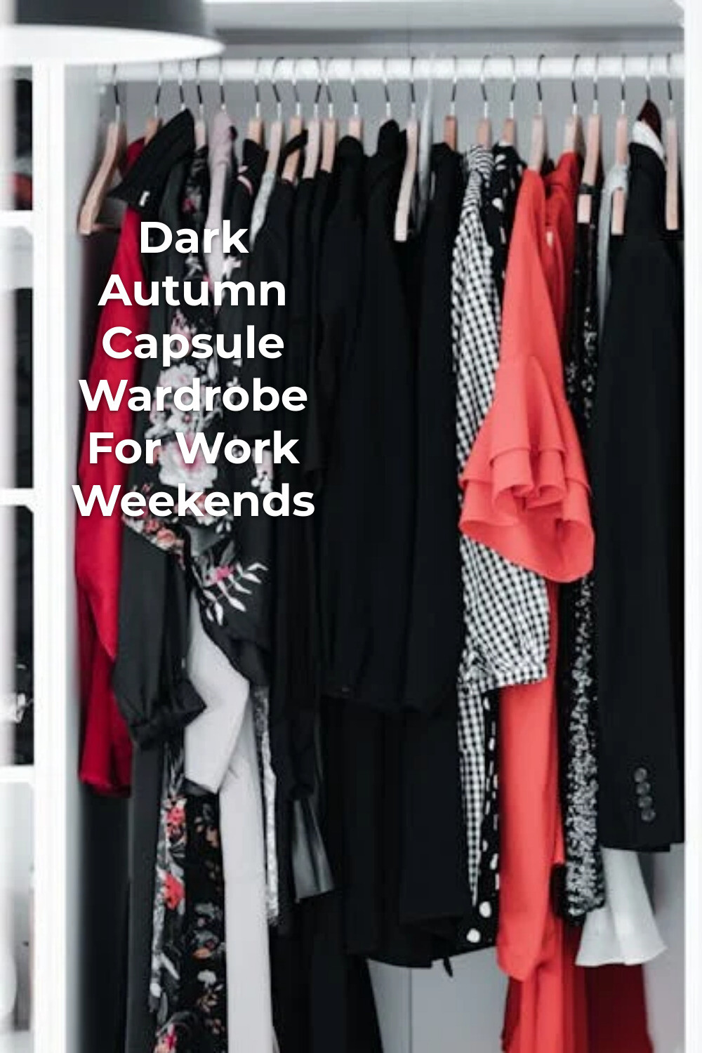 Dark autumn capsule wardrobe with black, red and patterned dresses and jackets on wooden hangers in an open closet