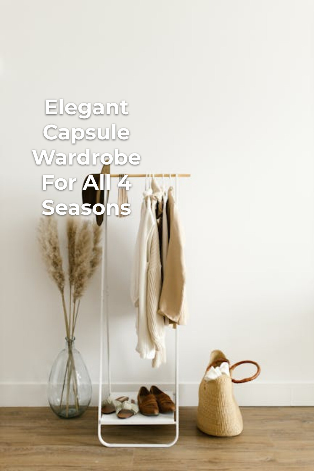 Elegant Capsule Wardrobe Rack in Neutral Tones Elegant capsule wardrobe on a clothing rack with light-toned outfits, hat, shoes, dried plants, and woven bag