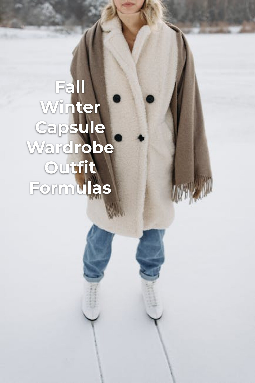 Fall winter capsule wardrobe outfit with white coat, brown shawl, blue jeans, and white boots on snow