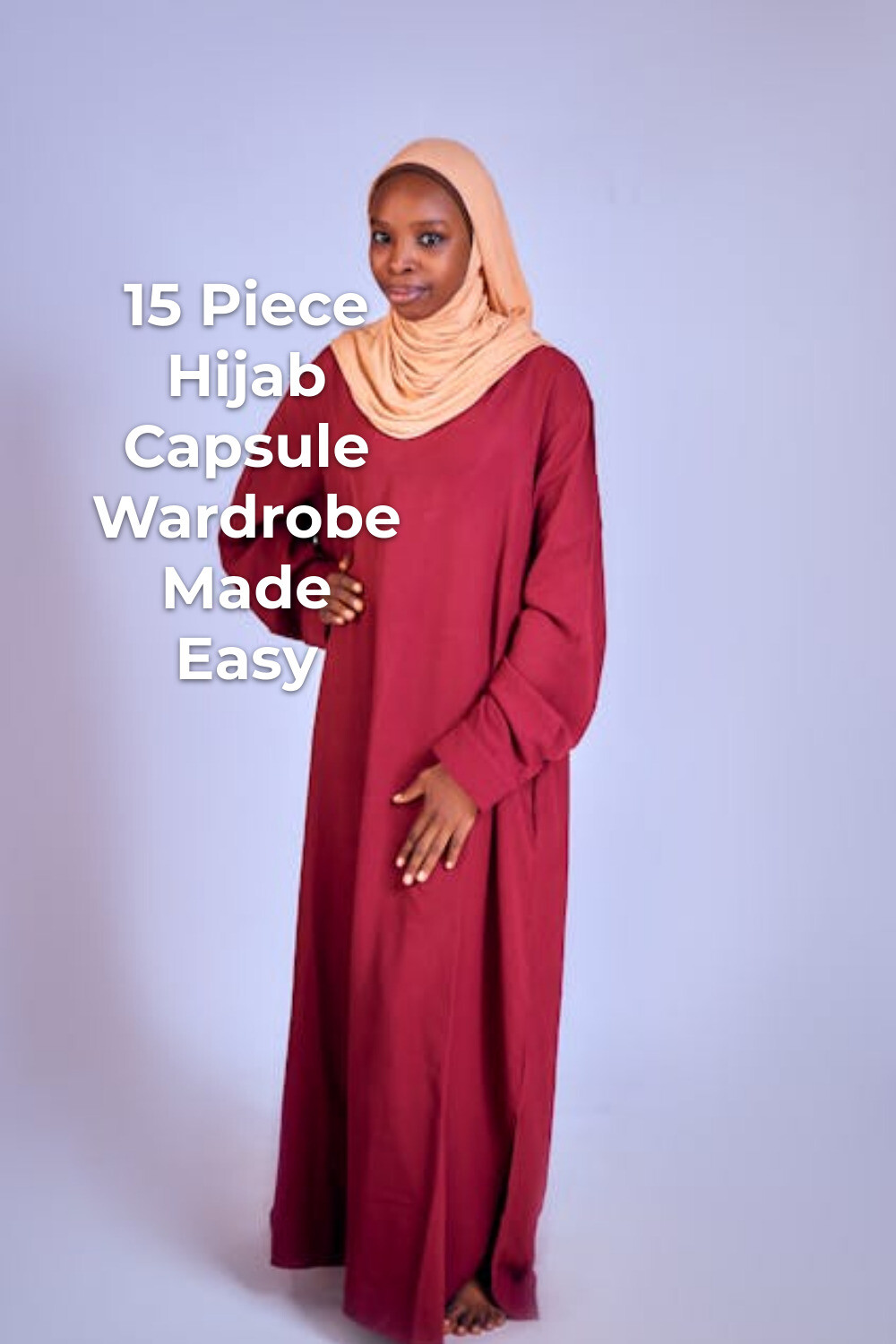 Hijab capsule wardrobe look with long red dress and beige headscarf against a plain background