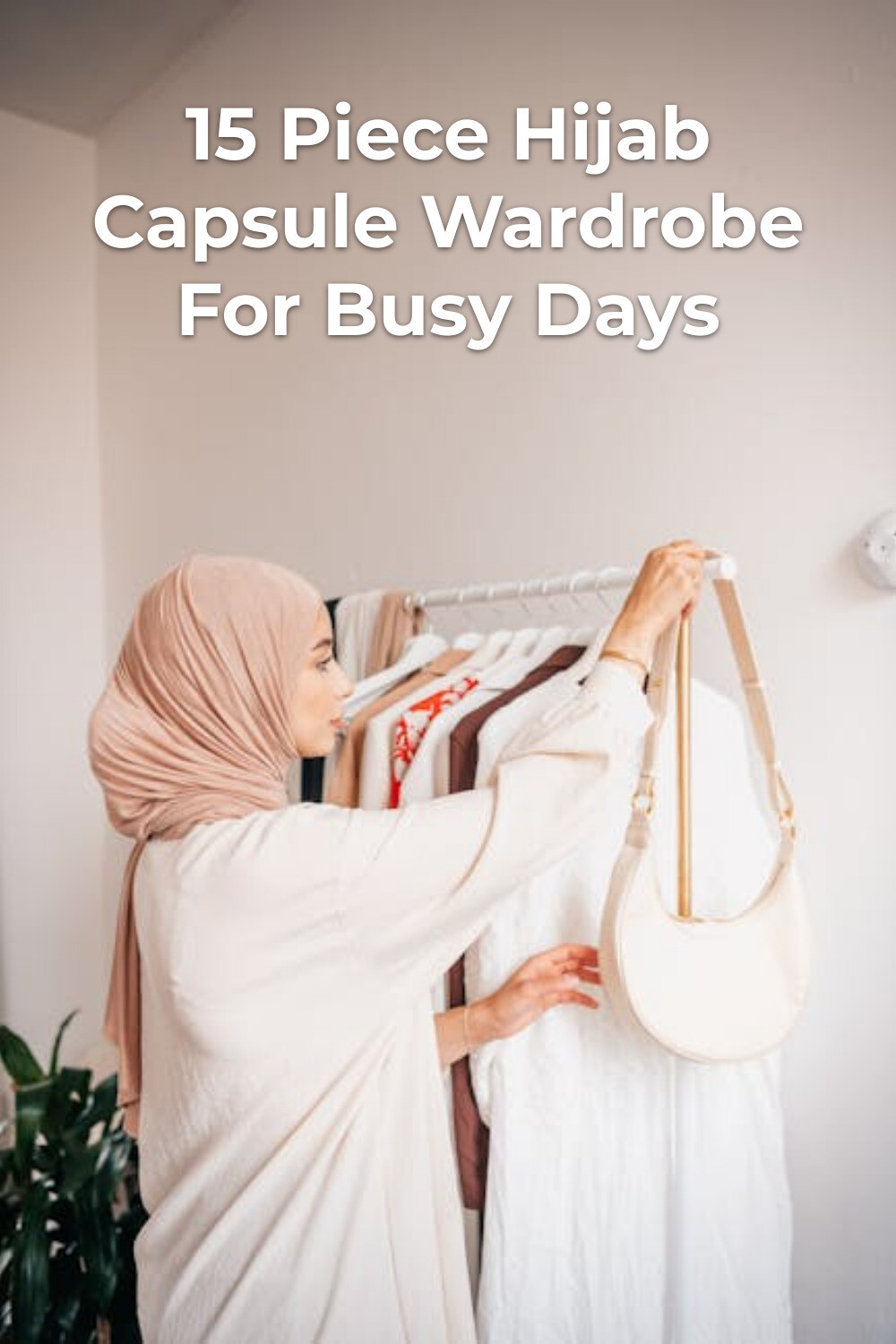 Hijab capsule wardrobe: woman in headscarf holding a light handbag beside a clothes rack