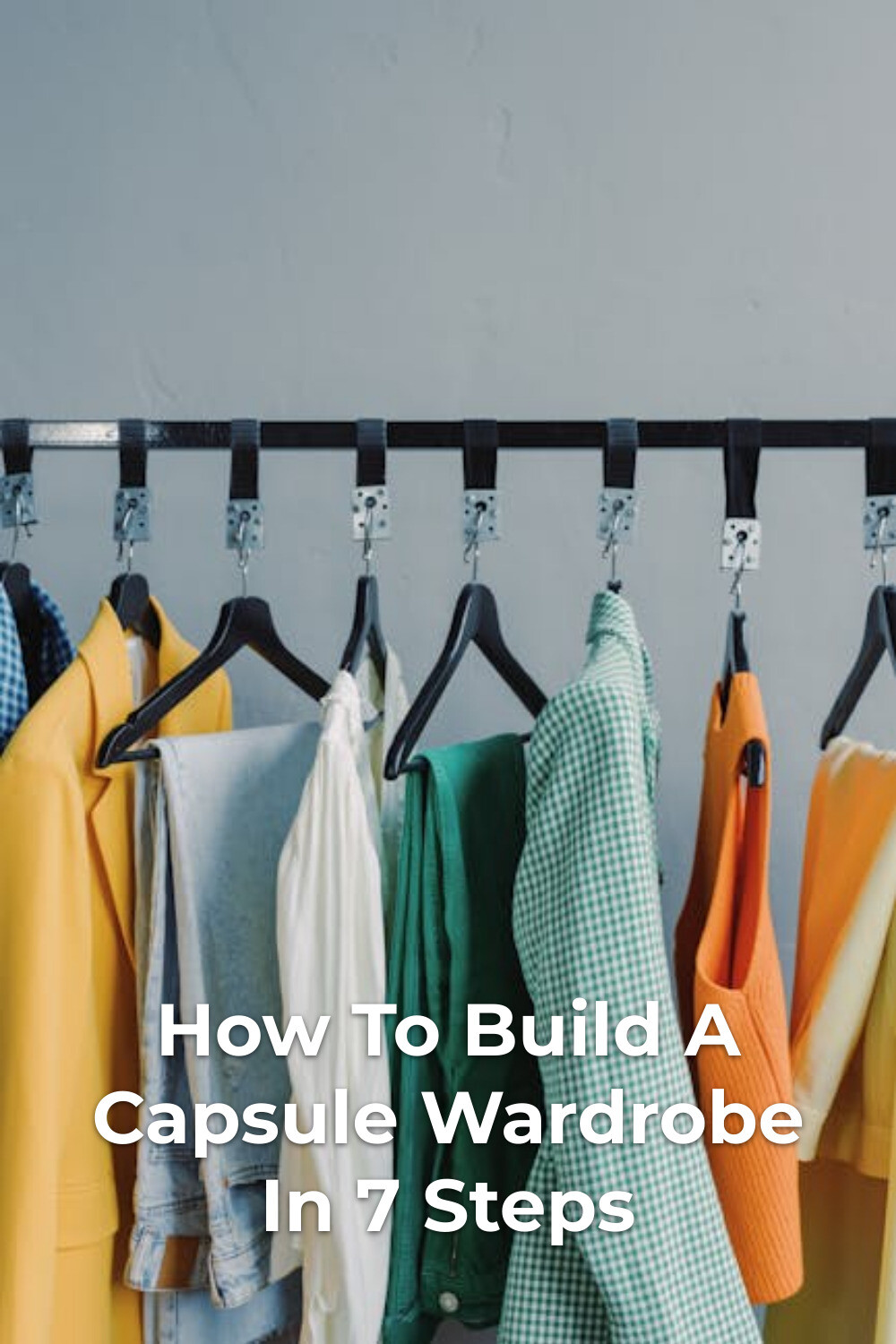 How to Build a Capsule Wardrobe: Colorful Rack Colorful clothes on black hangers on a rack, how to build a capsule wardrobe with a minimalist approach