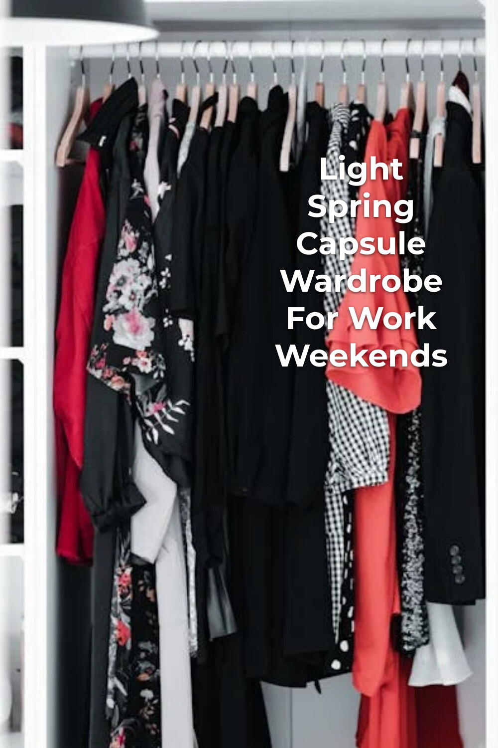 light spring capsule wardrobe with black, red, and patterned pieces hanging on hangers in an open closet