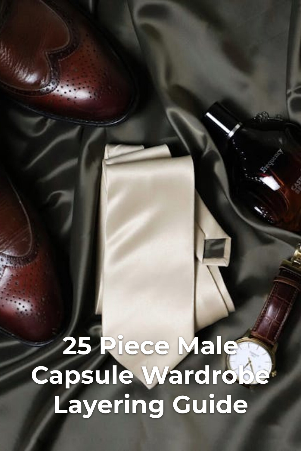 Male Capsule Wardrobe Accessories Flat Lay Male capsule wardrobe essentials with brown leather shoes, beige tie, wristwatch, and cologne on dark fabric
