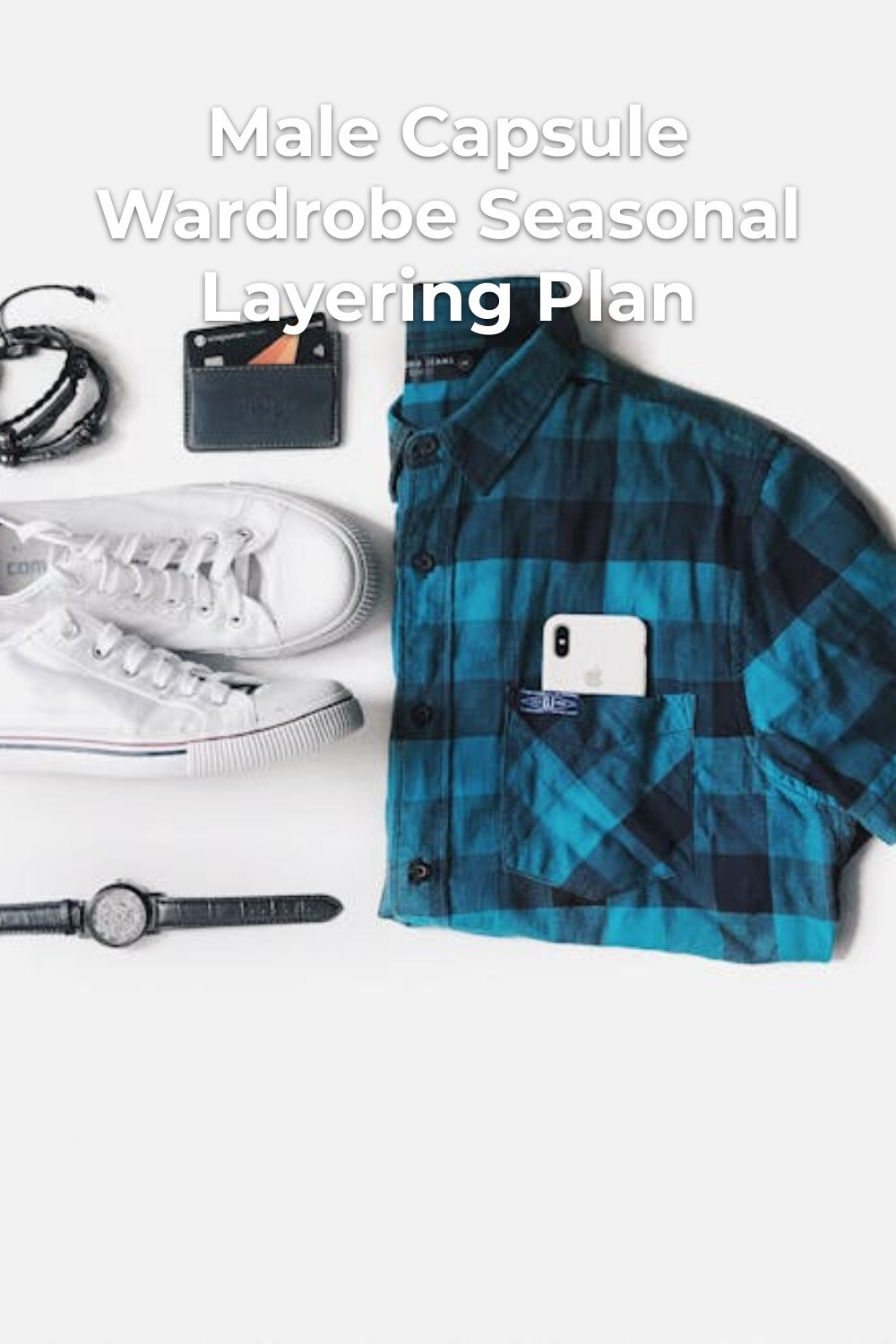 Male capsule wardrobe flat lay essentials Male capsule wardrobe essentials: blue plaid shirt with phone pocket, white sneakers, wallet, earphones and watch