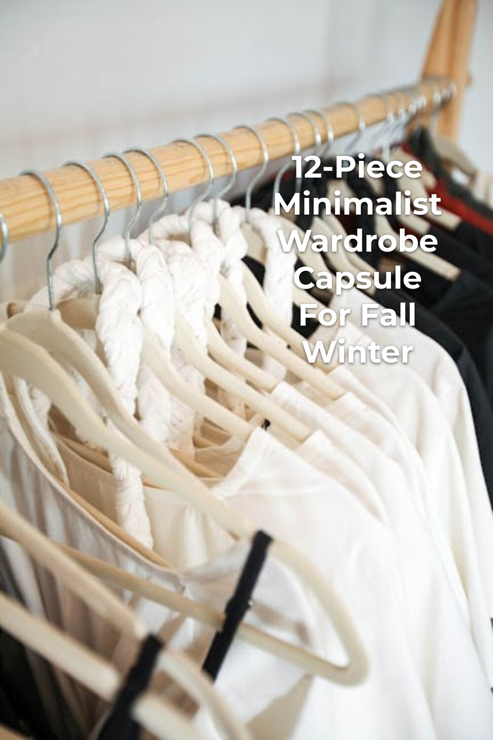 Minimalist Wardrobe Capsule Clothing Rack Minimalist wardrobe capsule with clothes on white and black hangers on a wooden clothing rack