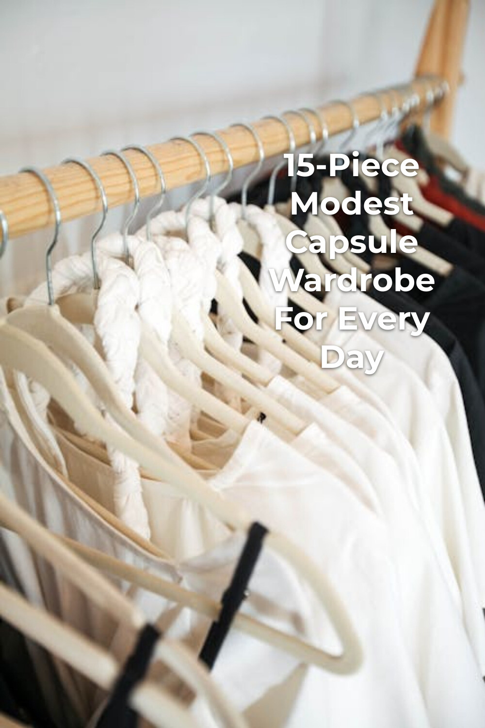 Modest Capsule Wardrobe Clothing Rack Modest capsule wardrobe with light and dark clothes hanging on a wooden clothing rack