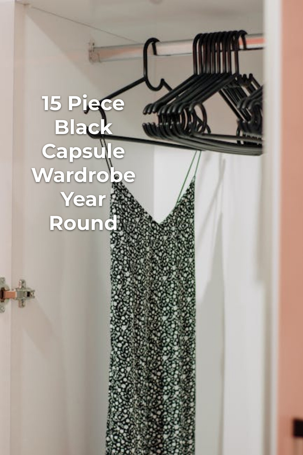 Patterned dress in black capsule wardrobe closet Patterned sleeveless dress on black hanger in a black capsule wardrobe closet