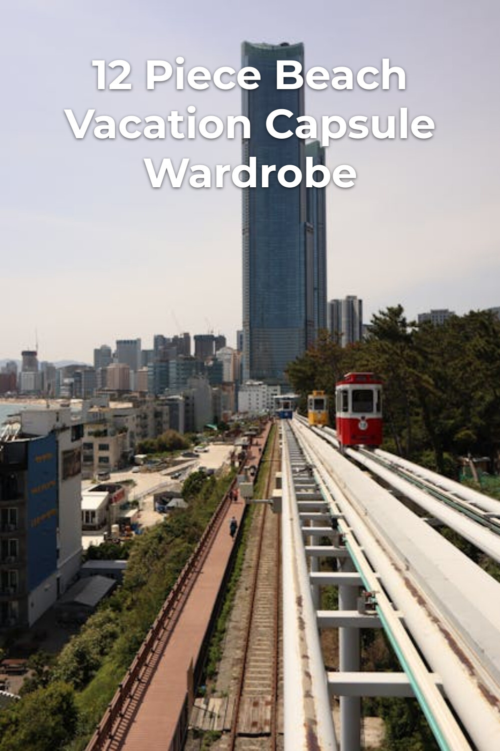 City Train View for Capsule Wardrobe Travel Red and white train on elevated tracks heading to skyline, minimalist beach vacation capsule wardrobe travel vibe