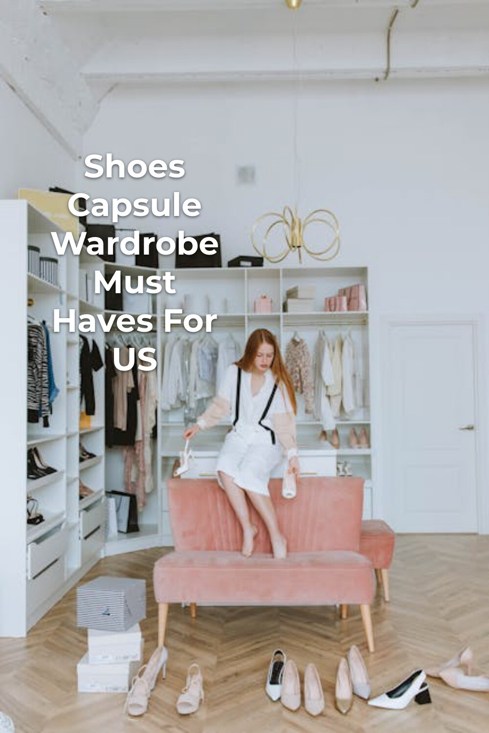Shoes capsule wardrobe: woman in white outfit on pink sofa in minimalist dressing room with shoes on the floor