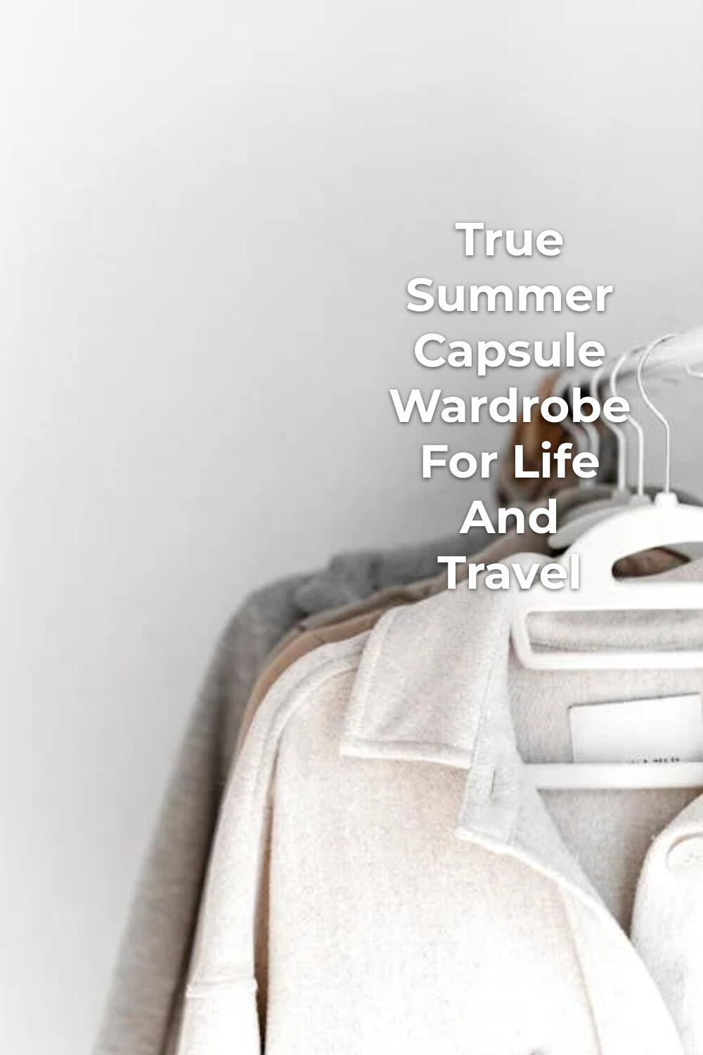 True Summer Capsule Wardrobe Sweaters True summer capsule wardrobe sweaters on white hangers against a light wall