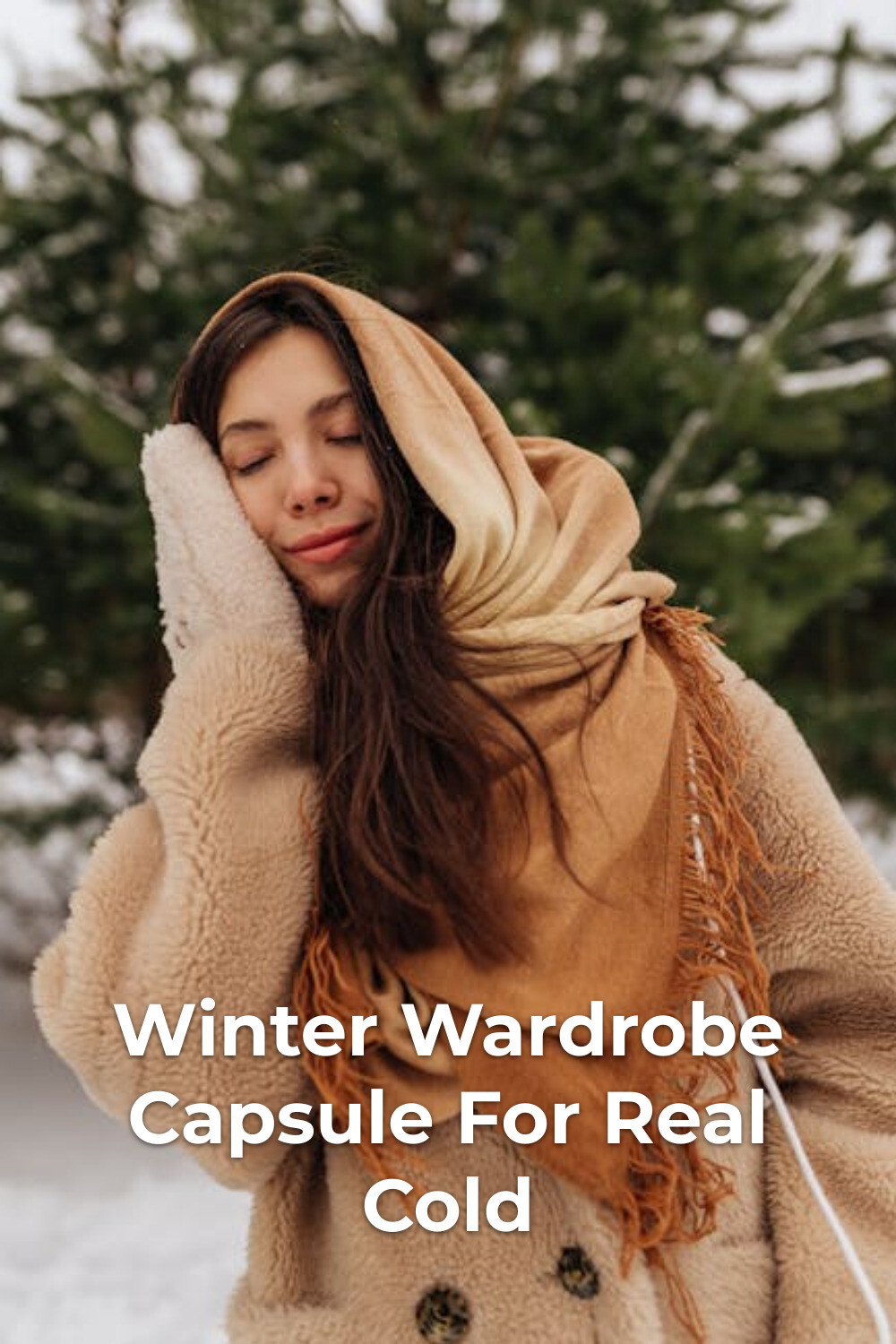 Winter Wardrobe Capsule: Beige Coat & Tan Scarf Winter wardrobe capsule look with beige coat and tan scarf in snowy evergreen landscape