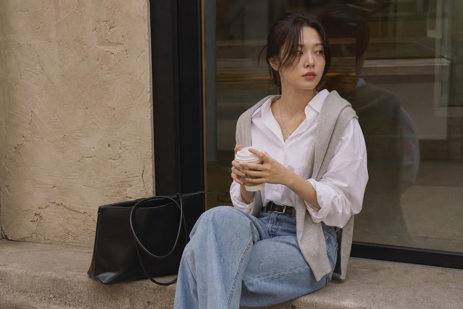 Korean casual outfits in spring neutrals with oversized shirt and wide-leg jeans, polished everyday street style look